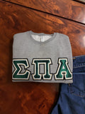 Sigma Pi Alpha 4662M Jerzees Crewneck Sweatshirt with Midnight Green Letters and White Thread on Shimmering Gold and Black Thread