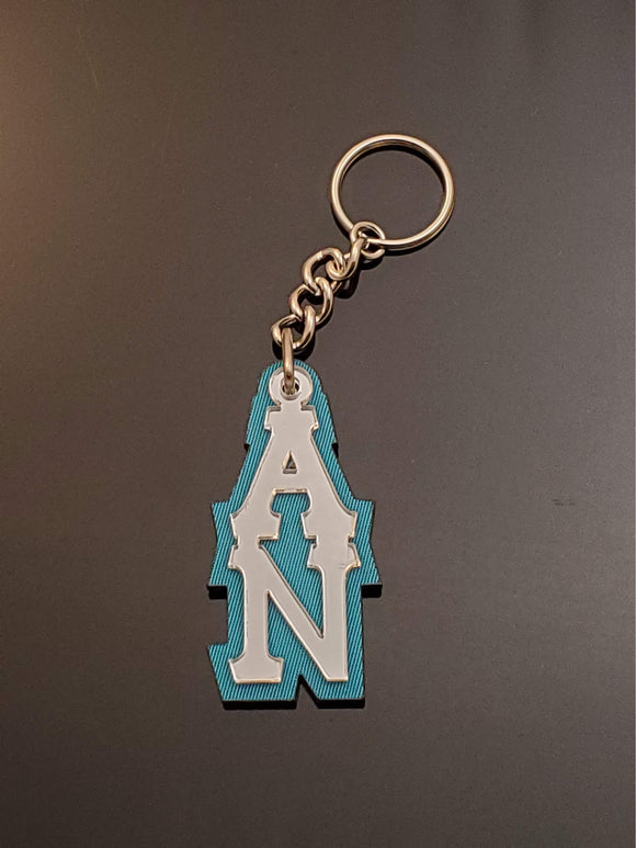 Alpha Nu - Keychain, Acrylic - Mirror Letters on Turquoise Twill